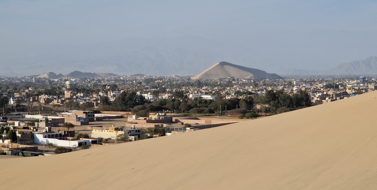 View over the city of Ica with in the distance yet another huge sand dune 